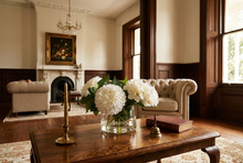 White chrysanthemum and hydrangea arrangement in a Classic bowl on a coffee table in a Toorak Victorian home.