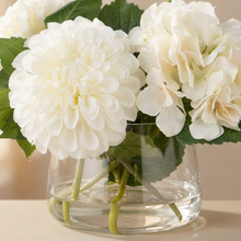 Close-up of the pom-pom chrysanthemum heads and soft hydrangea cloud in the Classic bowl.