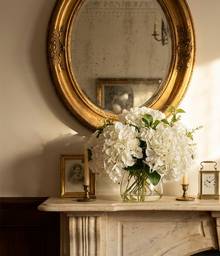 White hydrangea arrangement styled on a period marble mantel in a Toorak Victorian home.