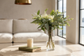 Native pincushion and eucalyptus arrangement in a Phoebe glass vase on a Mosman harbourside coffee table.