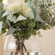 Close-up of the cream pincushion bloom, baby blue gum leaves and native berries in the Phoebe vase.