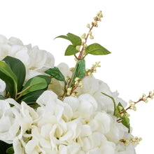 Cream nite-berry sprigs close-up with white hydrangea and green leaves